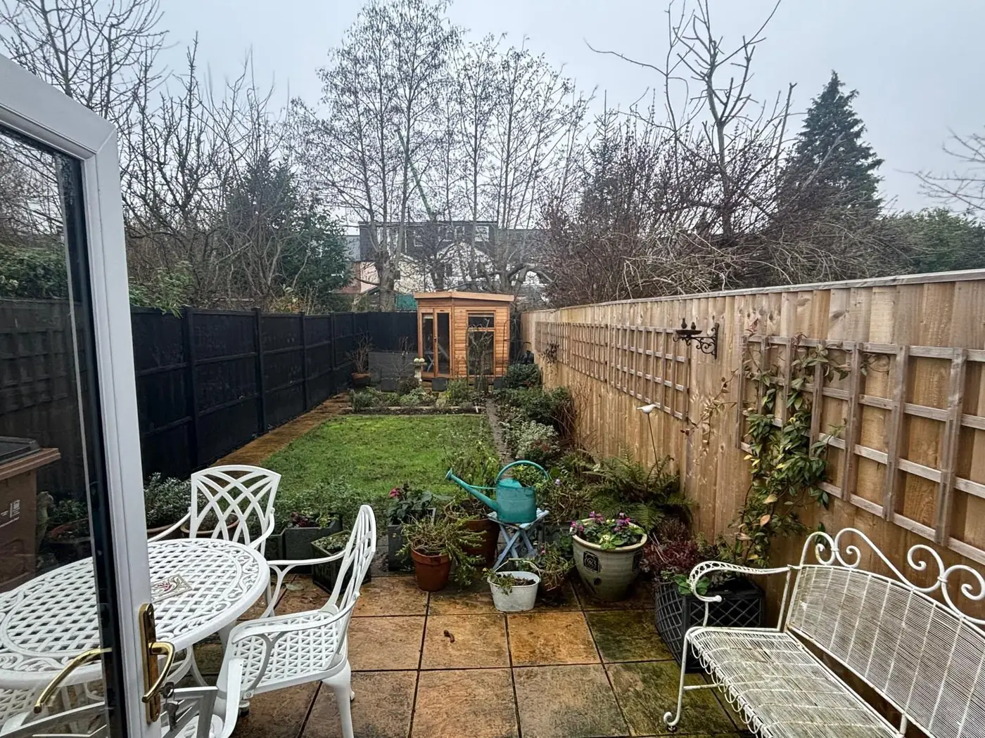 Rear garden with patio furniture and shed included in a full property clearance