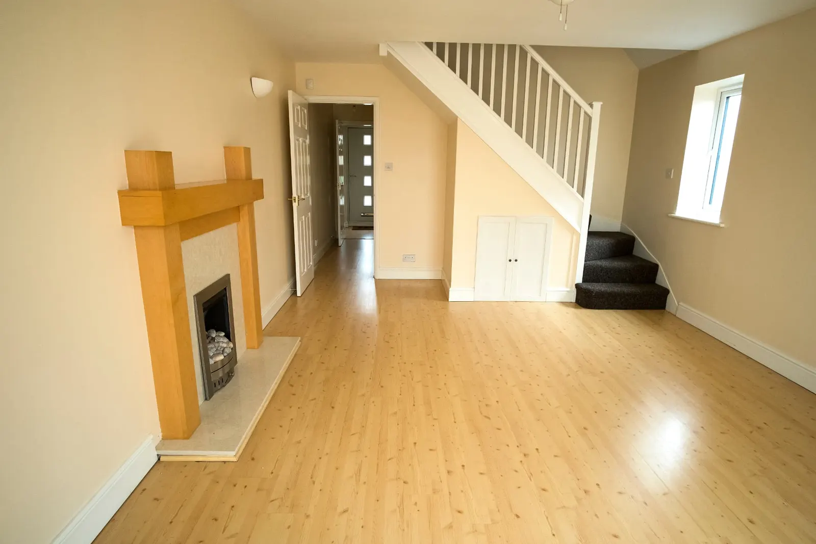 Empty living room cleared and swept ready for handover after a same-day emergency house clearance in Oxfordshire