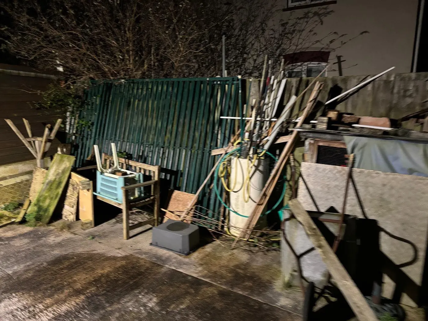 Outdoor area with discarded materials collected during a property clearance