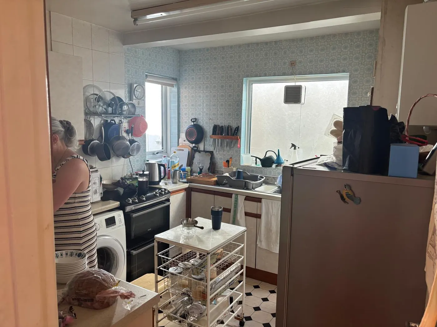 Kitchen clearance with appliances, cookware and cupboard contents ready to be removed